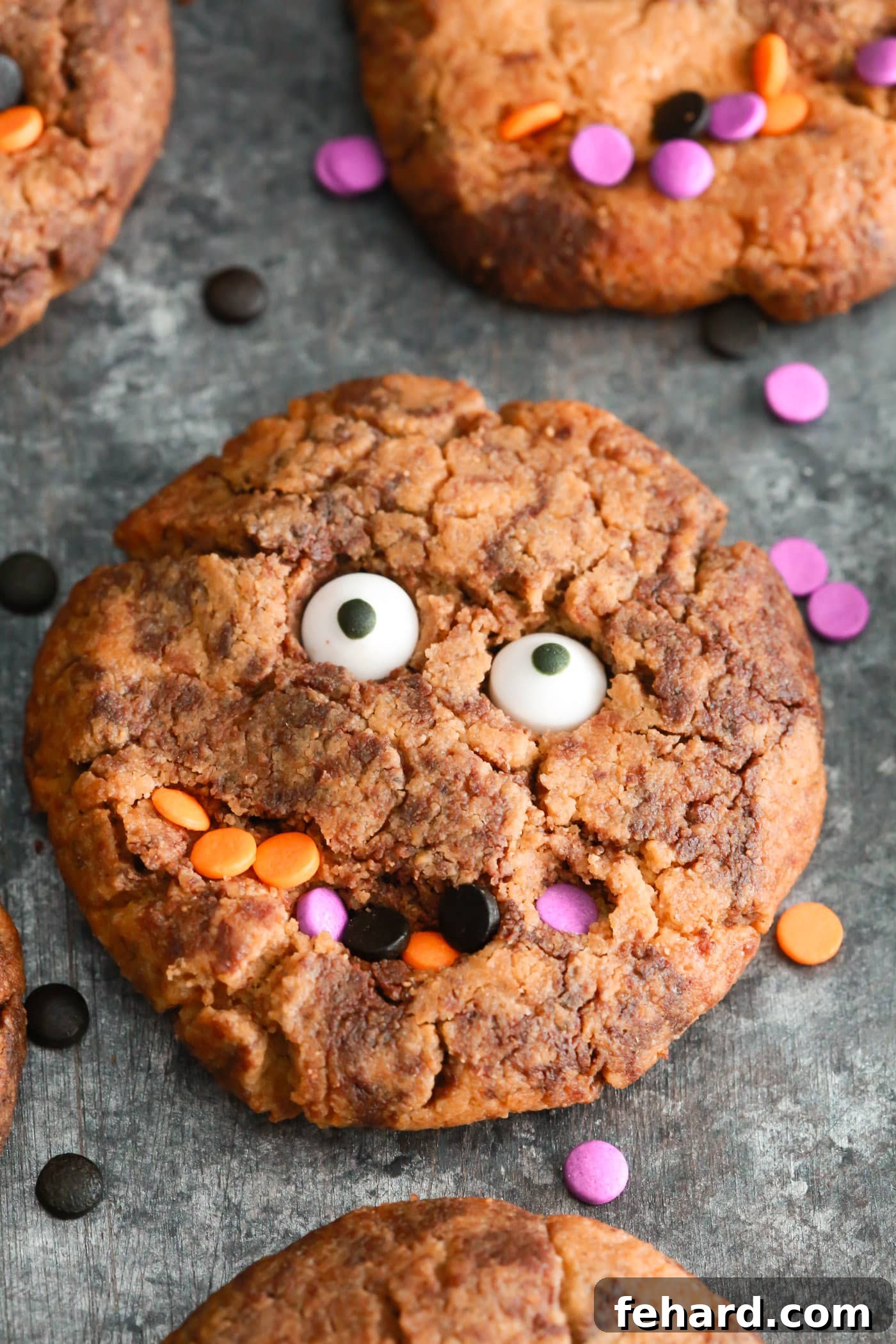 Easy Halloween Cookie Recipe for Kids Perfect fun Gluten-free Halloween cookies to make with your kids. They’re made with almond butter, natural sweetener and dark chocolate chips. A close-up shot of another batch of colorful monster cookies.