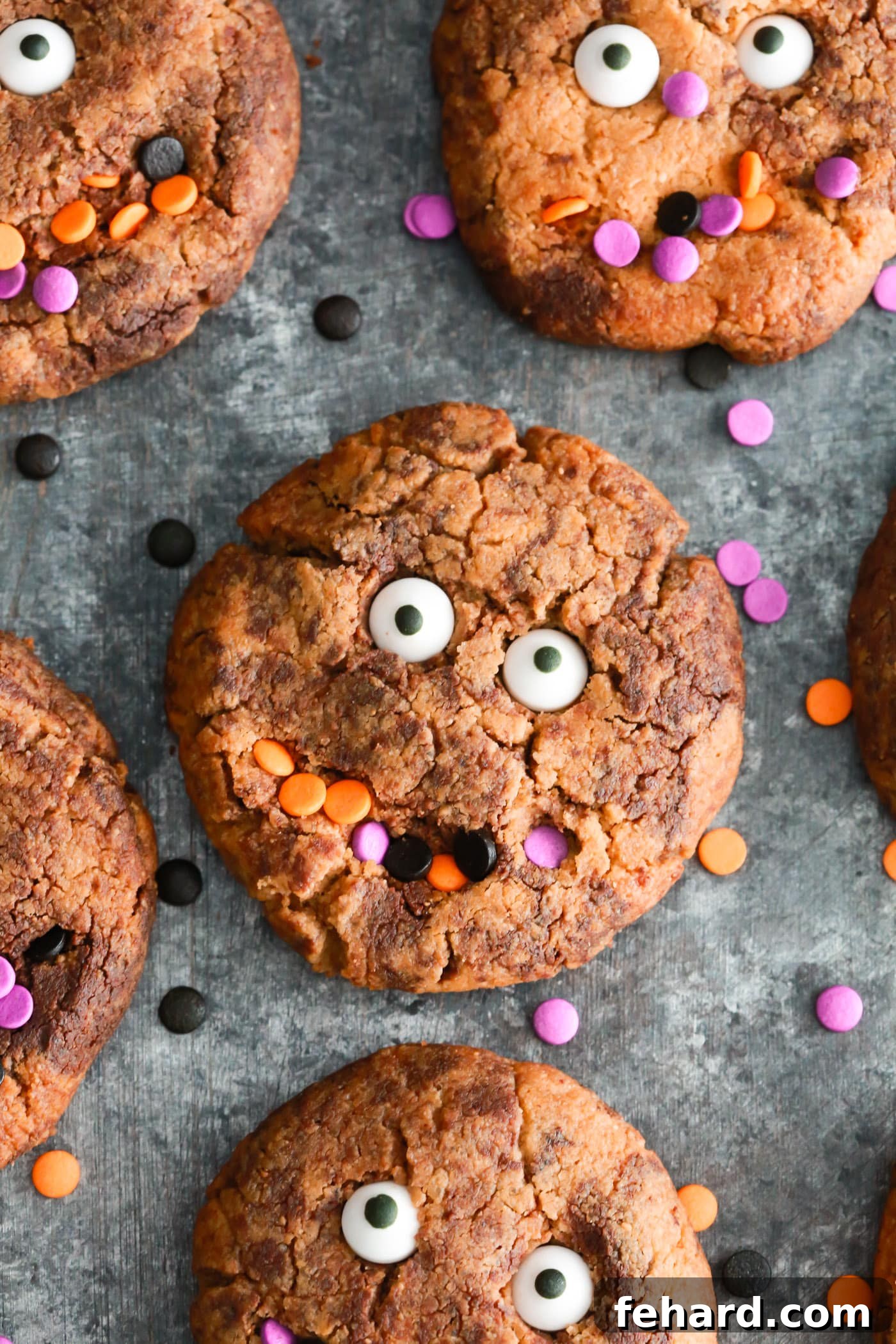 Healthy Halloween Treats for the Whole Family Perfect fun Gluten-free Halloween cookies to make with your kids. They’re made with almond butter, natural sweetener and dark chocolate chips. A close-up shot of a single decorated monster cookie.
