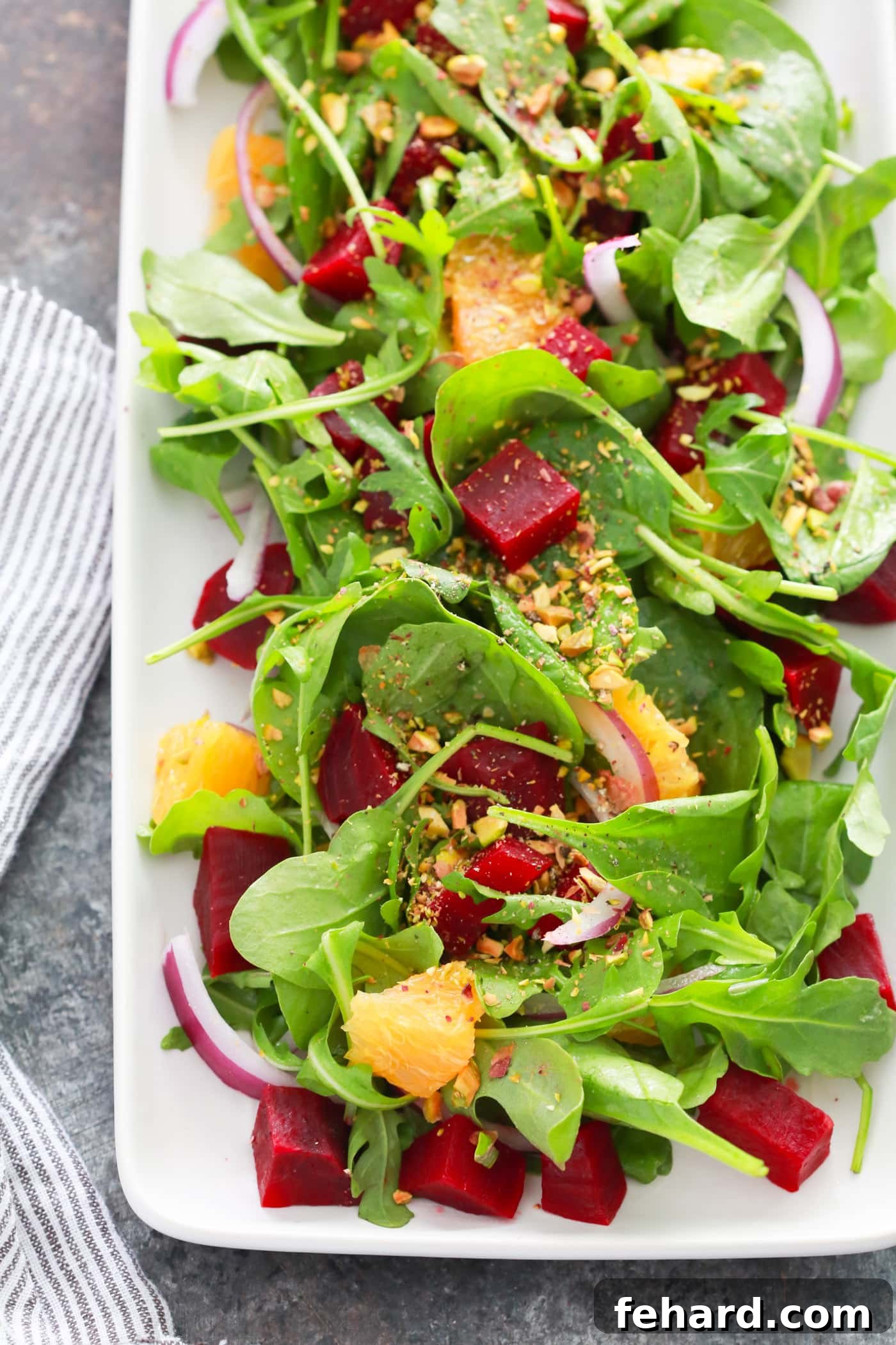 Fresh Autumn Beet Orange Salad with Tangy Dressing Close-up of Autumn Beet Orange Salad with pistachios and vinaigrette