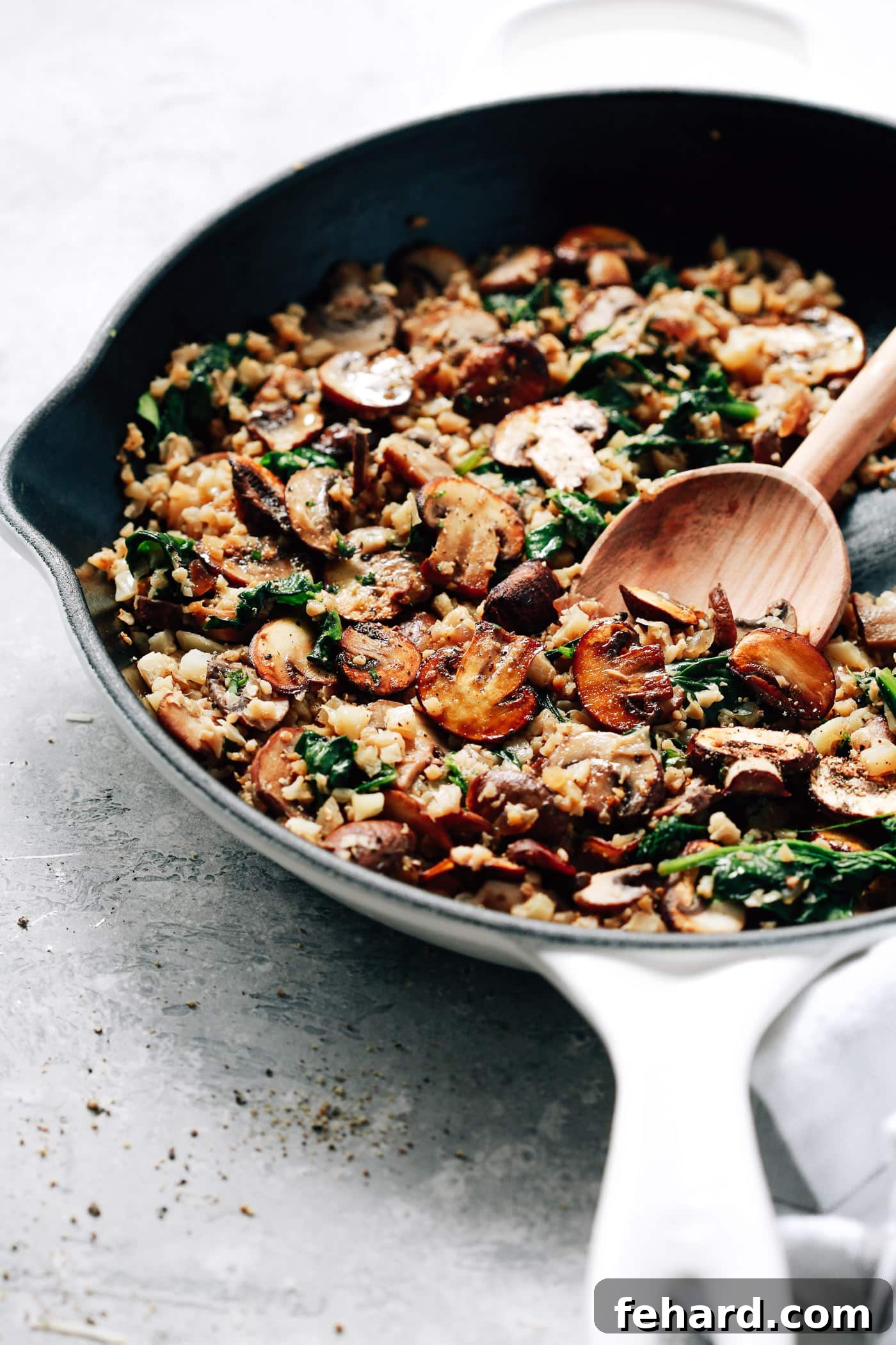 Healthy & Delicious Cauliflower Rice 3 closeup view of mushrooms, spinach and cauliflower