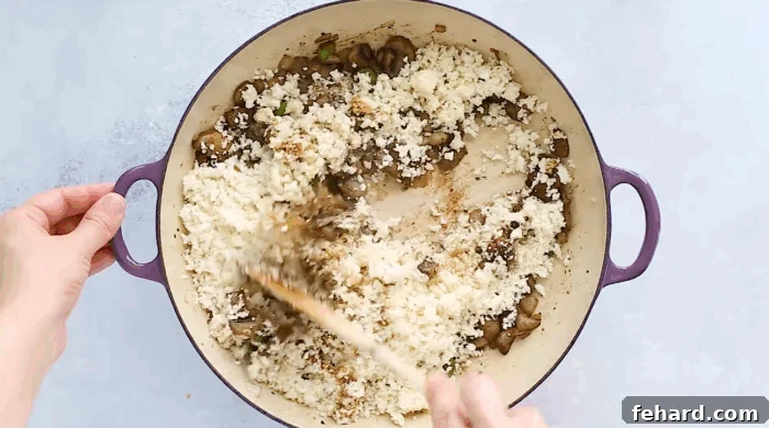 Healthy & Delicious Cauliflower Rice 6 cauliflower rice with mushroom in a skillet