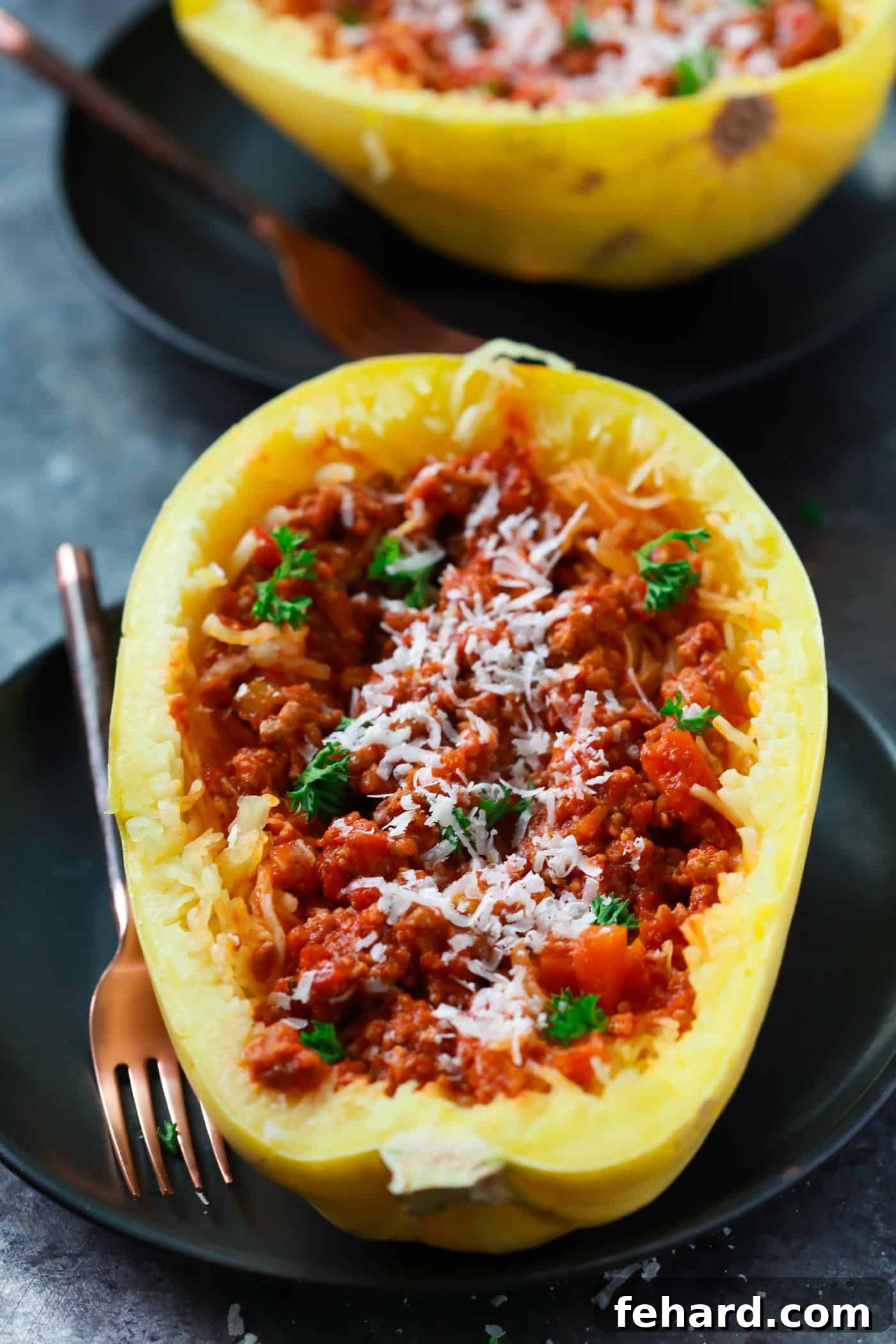 A complete meal of Bolognese Stuffed Spaghetti Squash on a plate, highlighting the tender squash strands and hearty sauce
