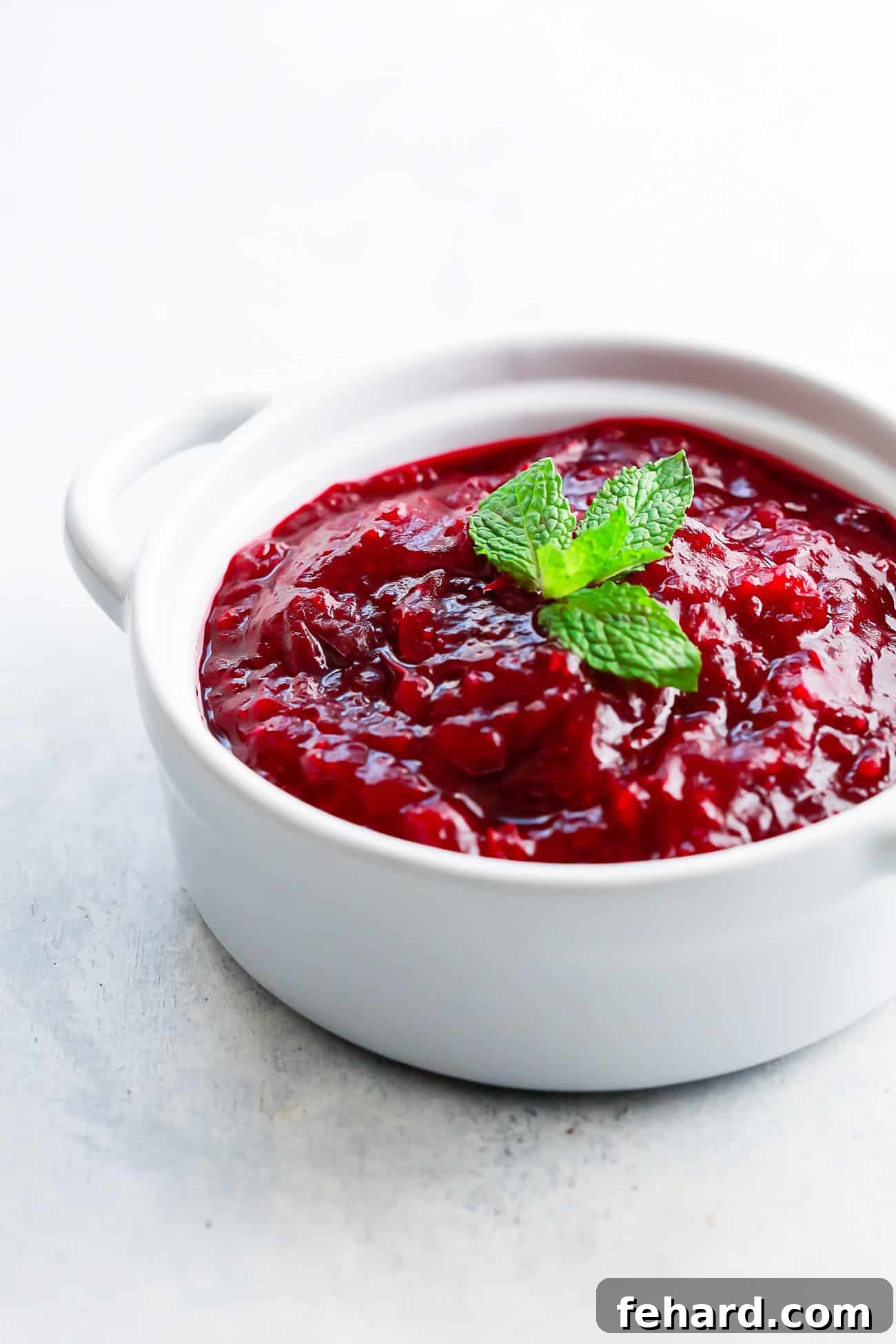 Guilt-Free Cranberry Zing 4 overhead view of instant pot cranberry sauce in a white pot.