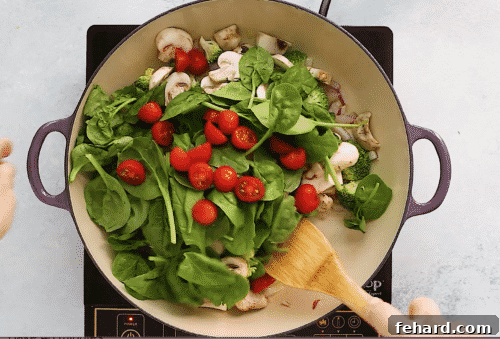 overhead view of a skillet with sautéed vegetables