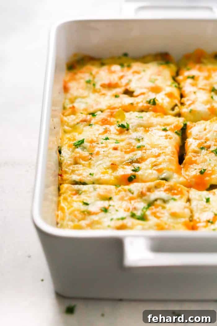 Close-up shot of the Make-Ahead Veggie Breakfast Casserole, showcasing its rich texture, golden-brown crust, and delicious fresh ingredients.