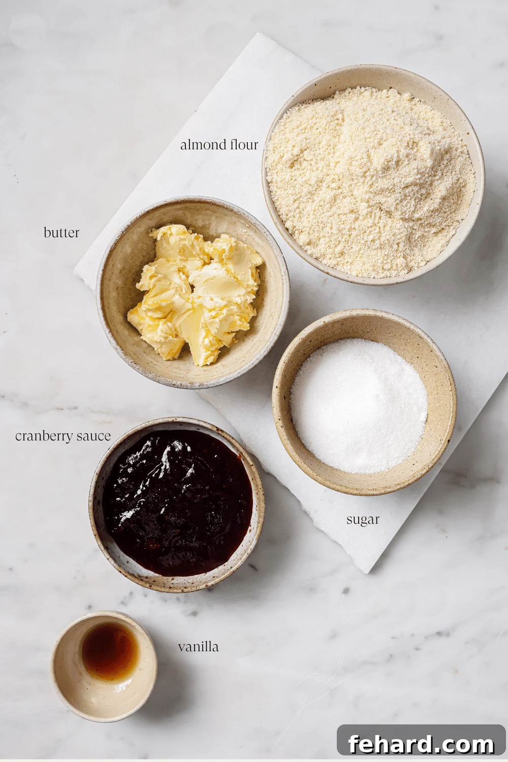 Pre-measured ingredients for Cranberry Thumbprint Cookies, neatly arranged.