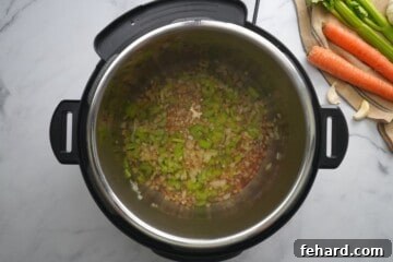 Wine added to inner pot after sauteeing celery and onions in inner pot.
