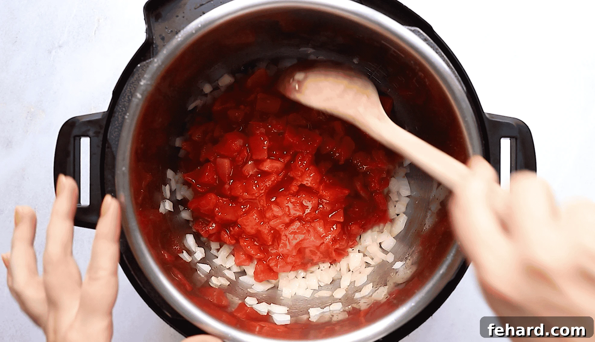 Instant Pot Mediterranean Chicken Feast 4 Overhead view of an Instant Pot with aromatic tomatoes and onions simmering, forming the base of the sauce.