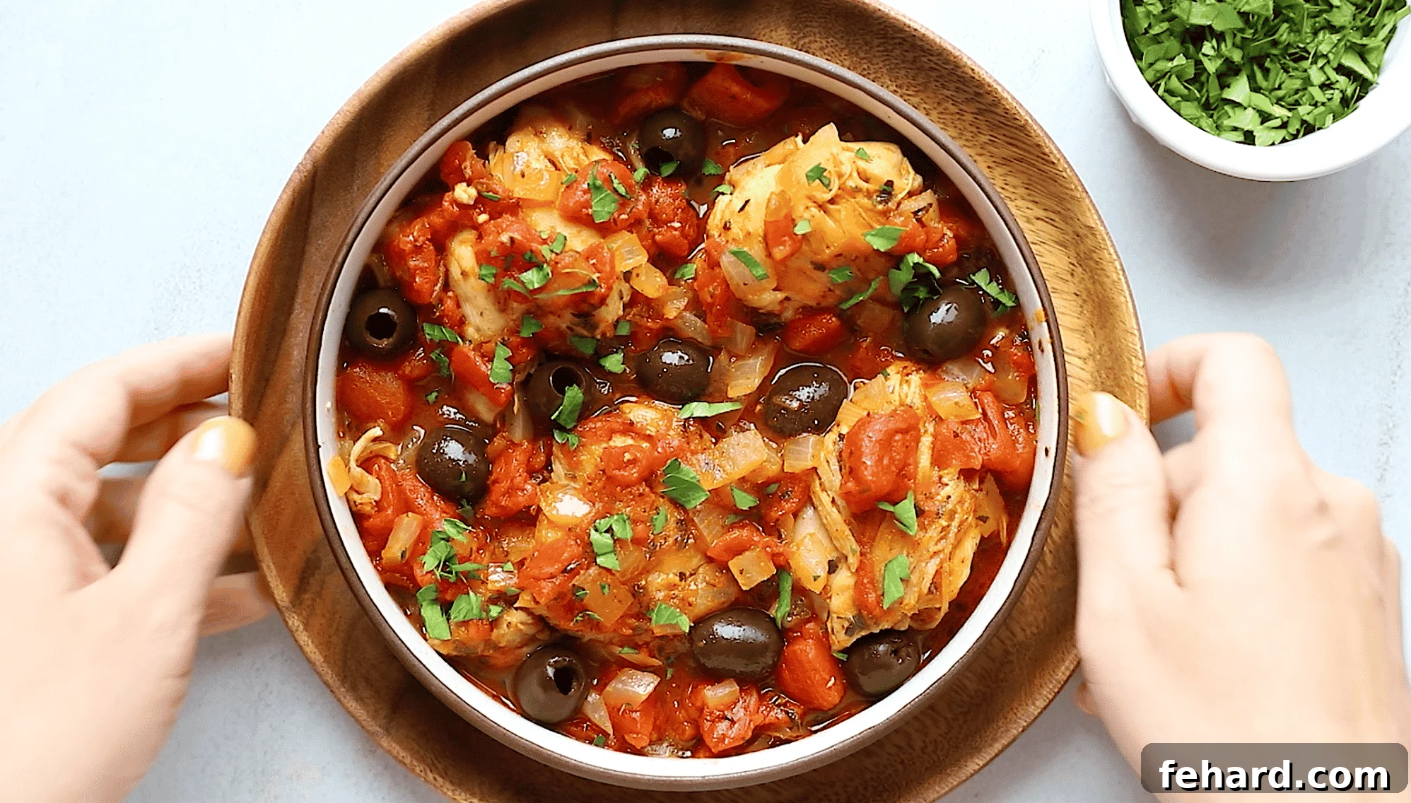 Instant Pot Mediterranean Chicken Feast 6 Overhead view of a delectable Instant Pot chicken recipe with rich tomato sauce served in a bowl, garnished with fresh herbs.