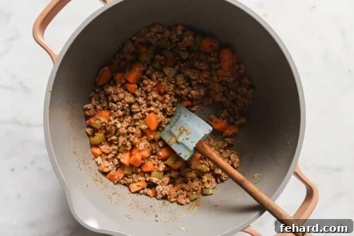 ground turkey and veggies in a grey pot