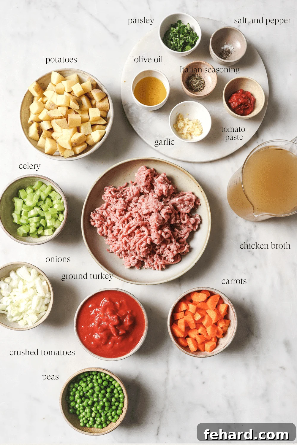 Various pre-measured ingredients for ground turkey soup, including vegetables, spices, and ground turkey, laid out in small bowls.