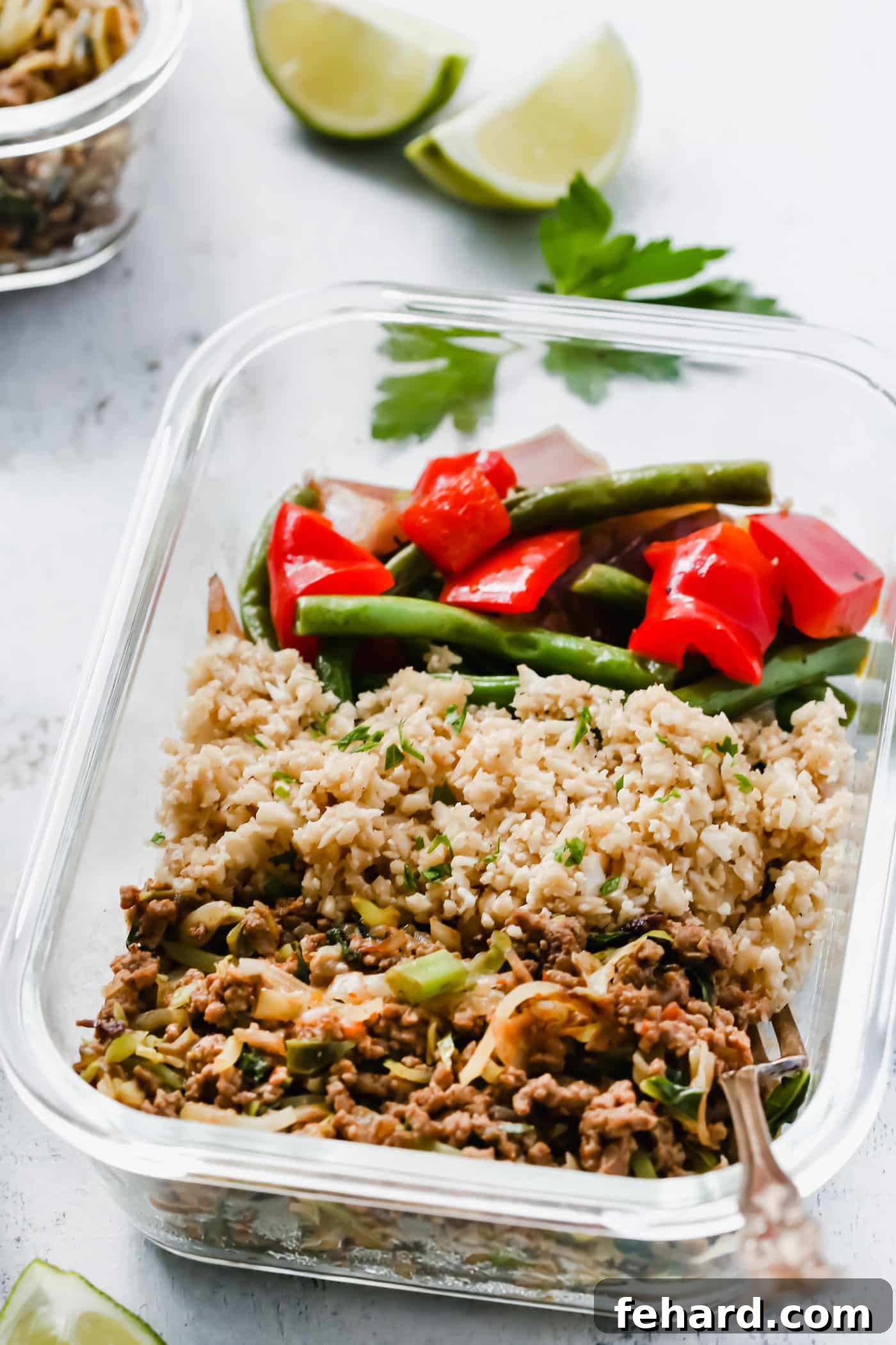 Ground turkey, cauliflower rice and veggie meal prep bowl.