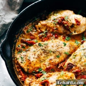 Creamy Parmesan Chicken Skillet with parsley garnish