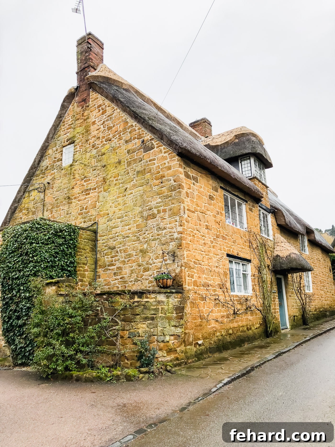 Another beautiful view of a quaint English cottage, highlighting its rustic charm