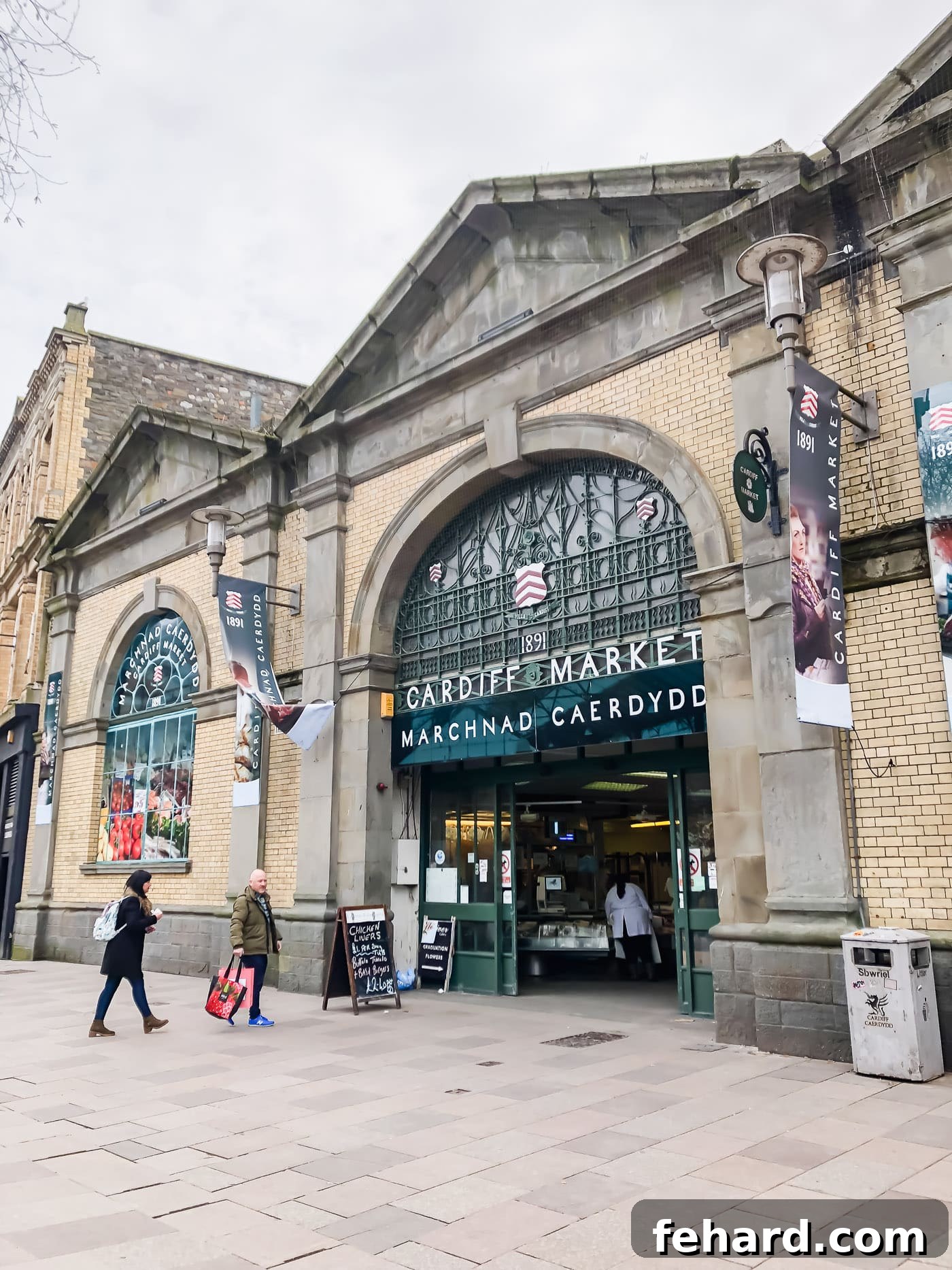 A lively view of Cardiff Market, bustling with local vendors and fresh produce