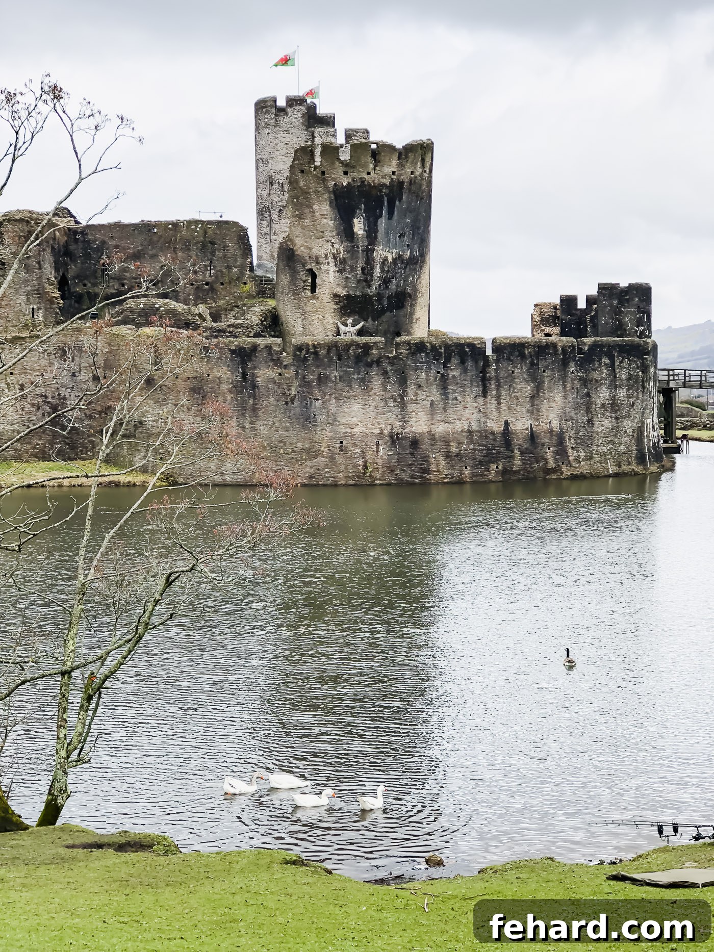Impressive exterior view of Caerphilly Castle, surrounded by its defensive moats