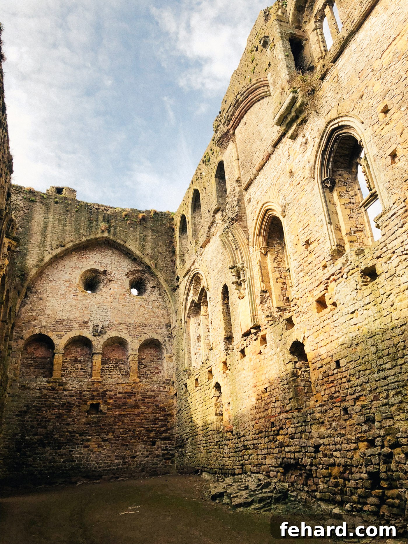 Wide exterior view of Chepstow Castle, showing its commanding position by the river