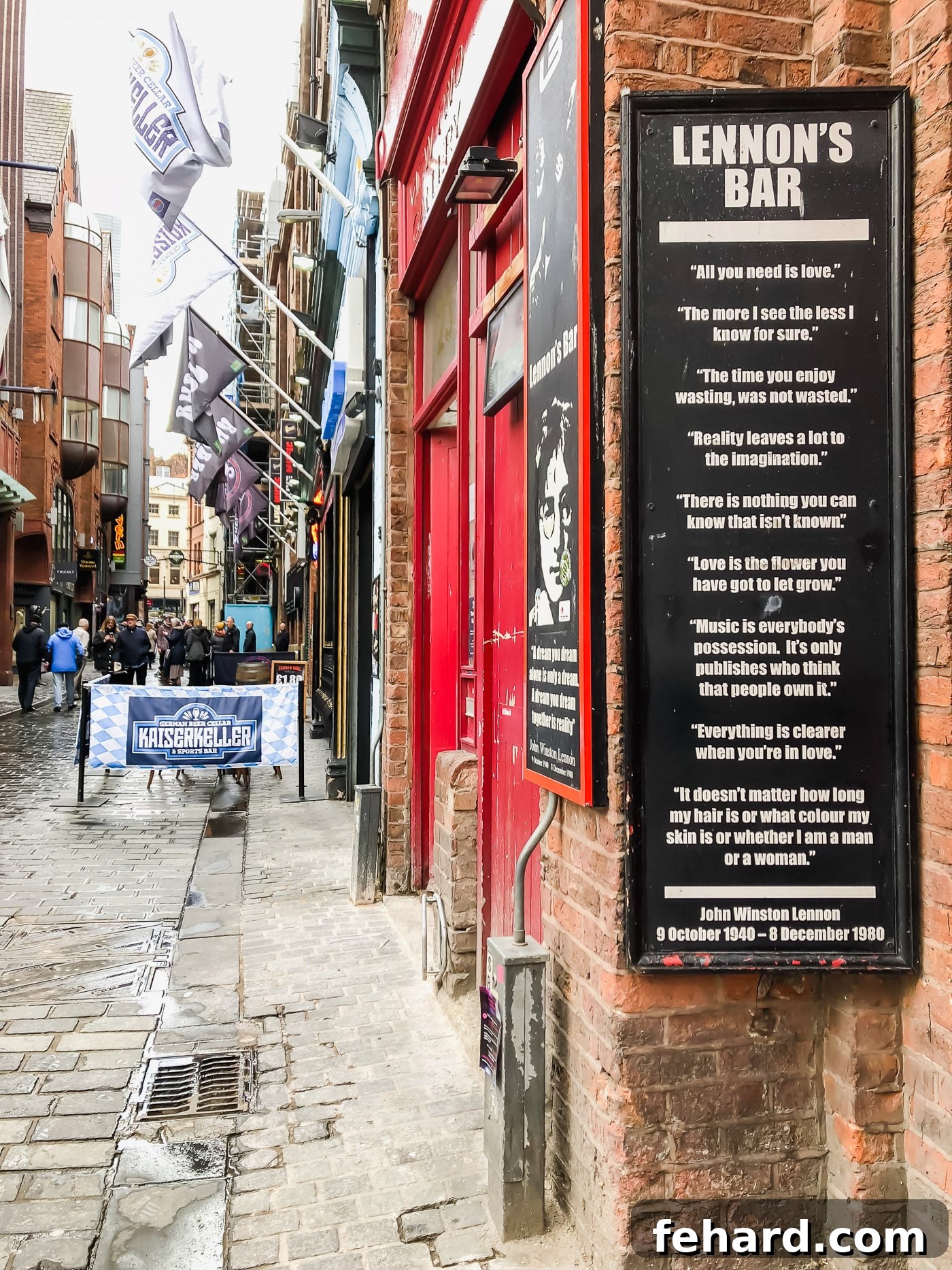 Another exterior view of 'Lennon's Bar' in Liverpool, with passersby