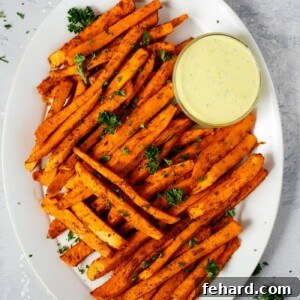 Irresistible Spicy Baked Sweet Potato Fries 4 Spicy Baked Sweet Potato Fries with a creamy dipping sauce