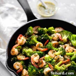 Zesty Chimichurri Prawns 7 Finished Chimichurri Shrimp with broccoli in a skillet, ready to serve.