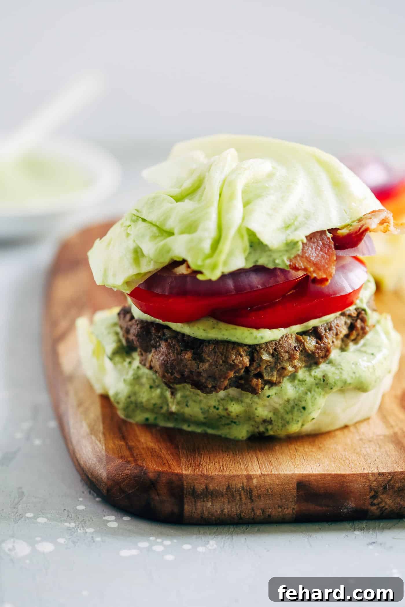 Spinach-Smothered Bunless Burger 4 Close-up of a Spinach Sauce Bunless Burger with Iceberg Lettuce Buns - Primavera Kitchen