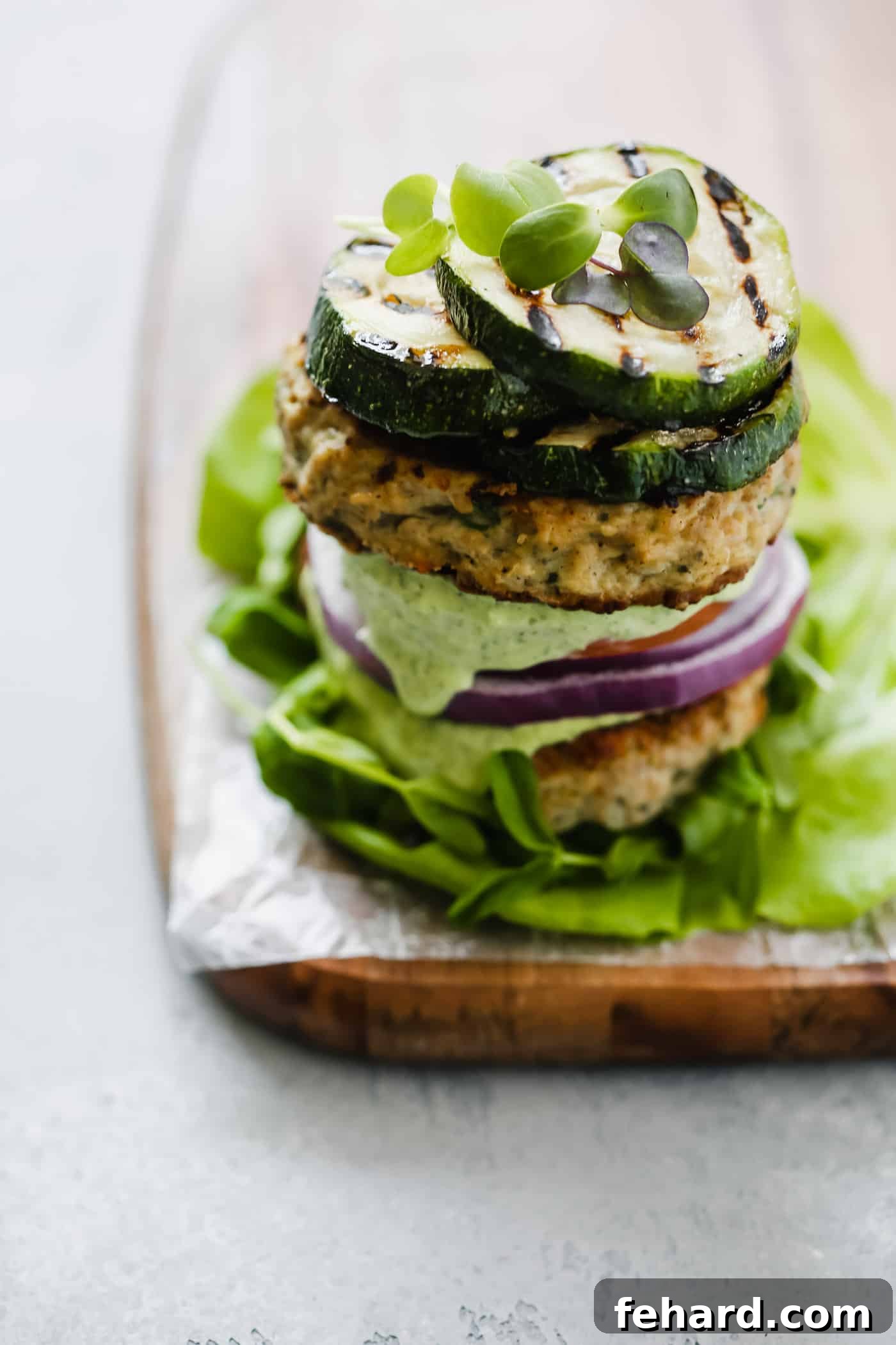 Close-up of a Whole30 Bunless Turkey Burger with avocado sauce