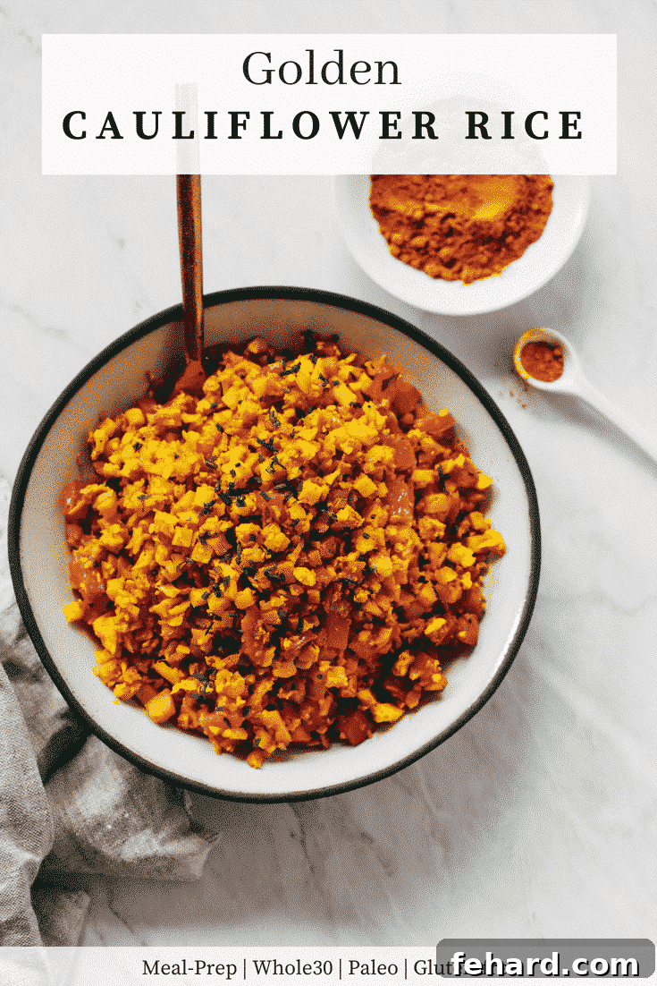 Sunshine Cauliflower Rice 5 A beautifully plated dish of Golden Cauliflower Rice with a serving spoon.