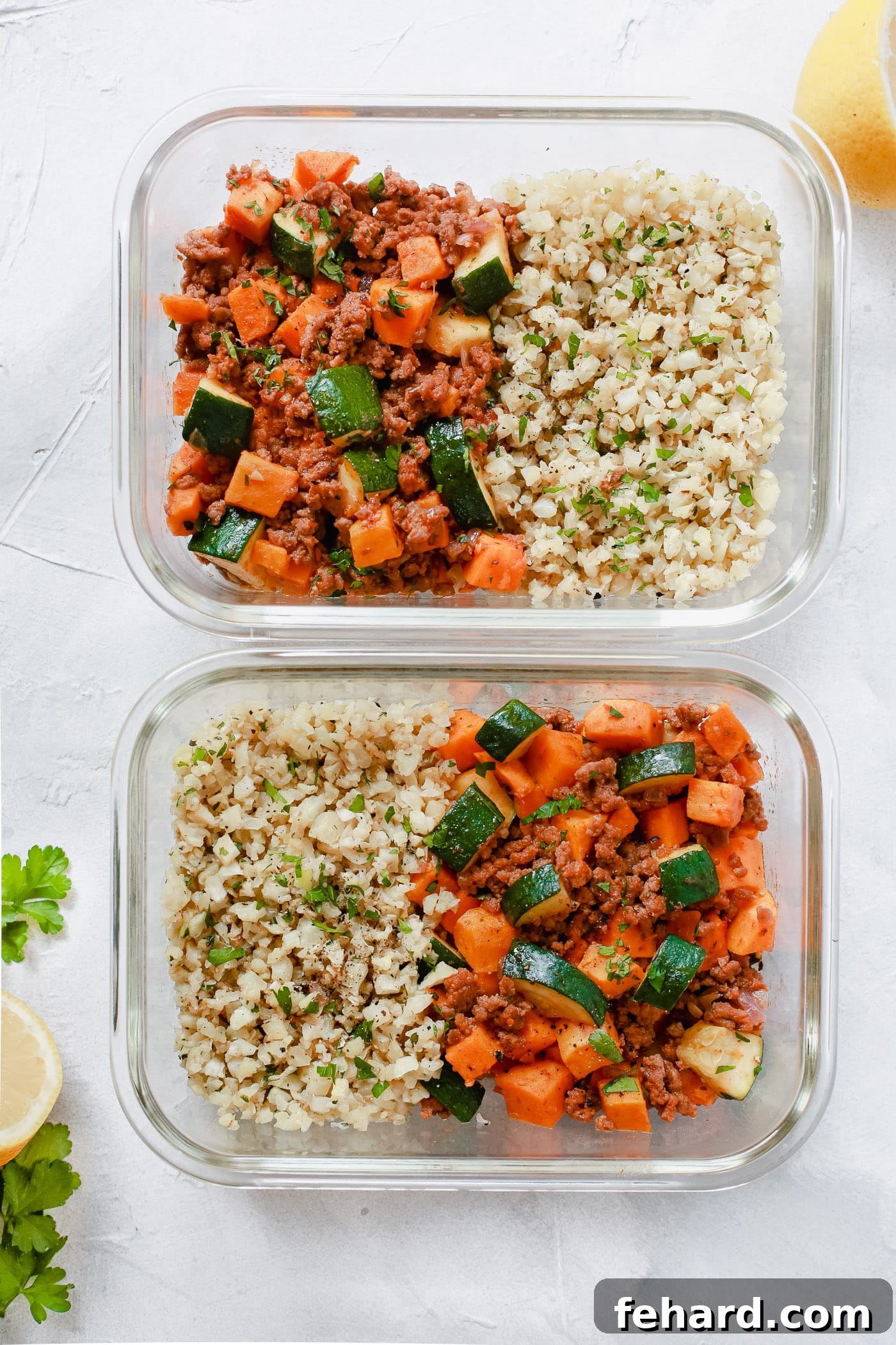 Two glass meal prep containers showcasing a delicious blend of ground beef, zucchini, sweet potatoes, and cauliflower rice, perfectly portioned for the week.