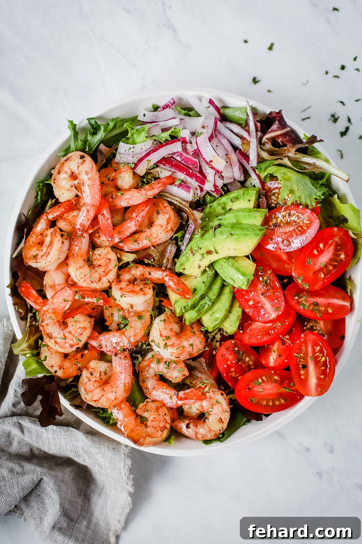 Close-up of Shrimp Tomato Salad with dressing drizzled over it