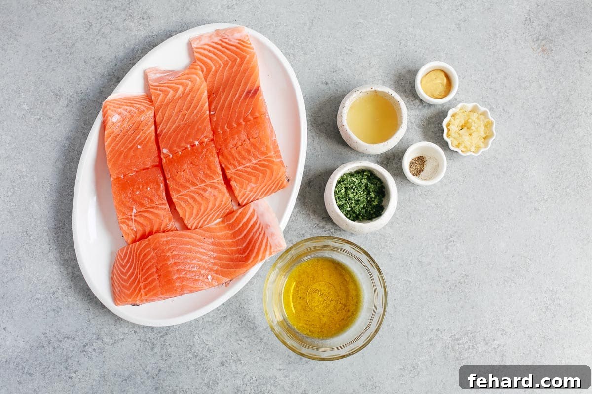 A collection of fresh ingredients laid out for making the mustard sauce for baked salmon.