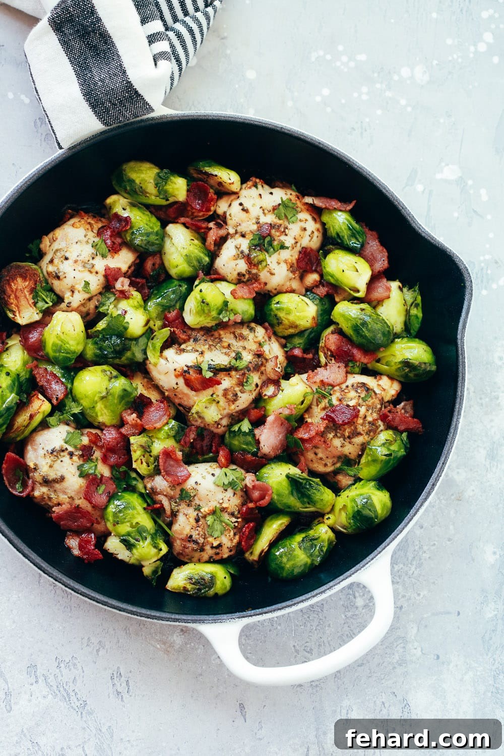 Effortless Chicken and Brussels Bake 3 Close-up of baked chicken and Brussels sprouts in a cast iron skillet