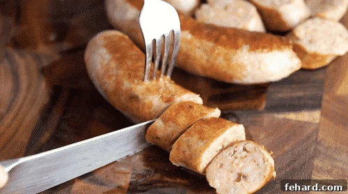 Cutting sausage on a wooden cutting board.
