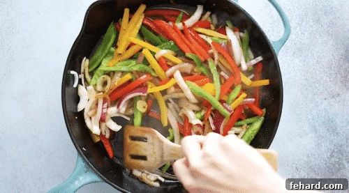 Deglazing the skillet with chicken broth.