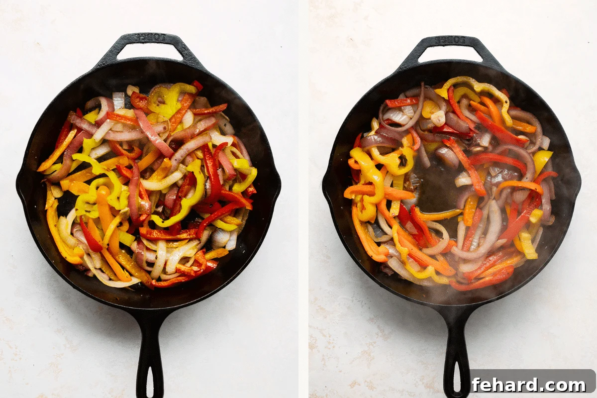 Overhead view of bell peppers and onions sautéing in a cast iron skillet.