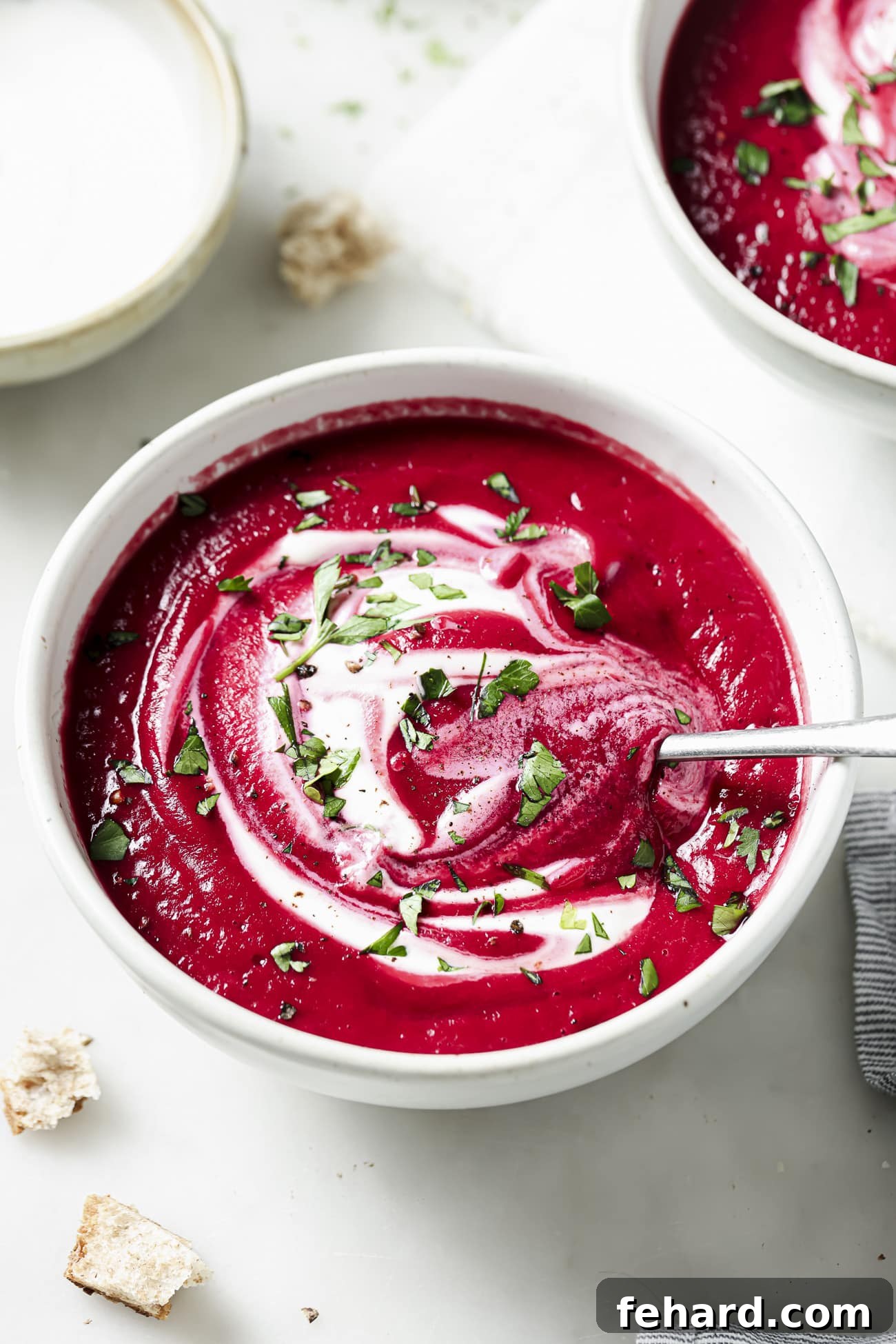 Vibrant Beetroot Soup 2 Beet soup in a white bowl with garnish.