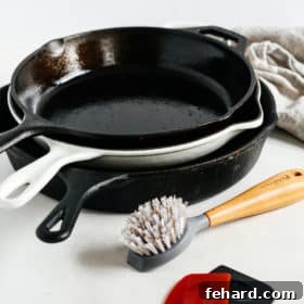 3 cast iron skillets in a countertop, showcasing essential kitchen tools