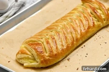 Baked Cream Cheese Danish on Parchment paper.