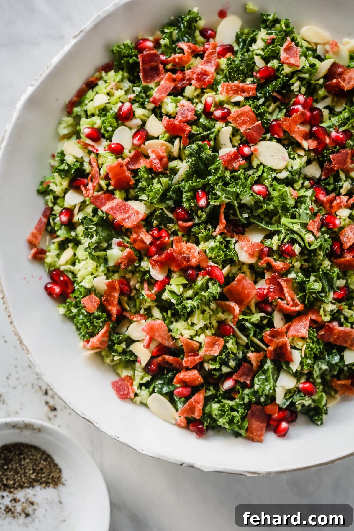 Shredded Brussels Sprout Salad with bacon, almonds, and pomegranate