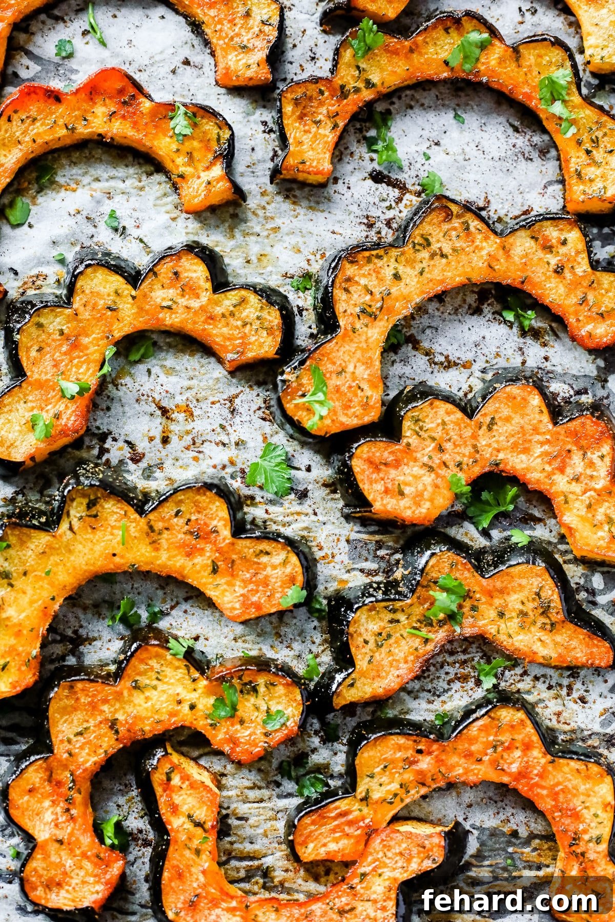close up - Easy Roasted Acorn Squash on a baking sheet