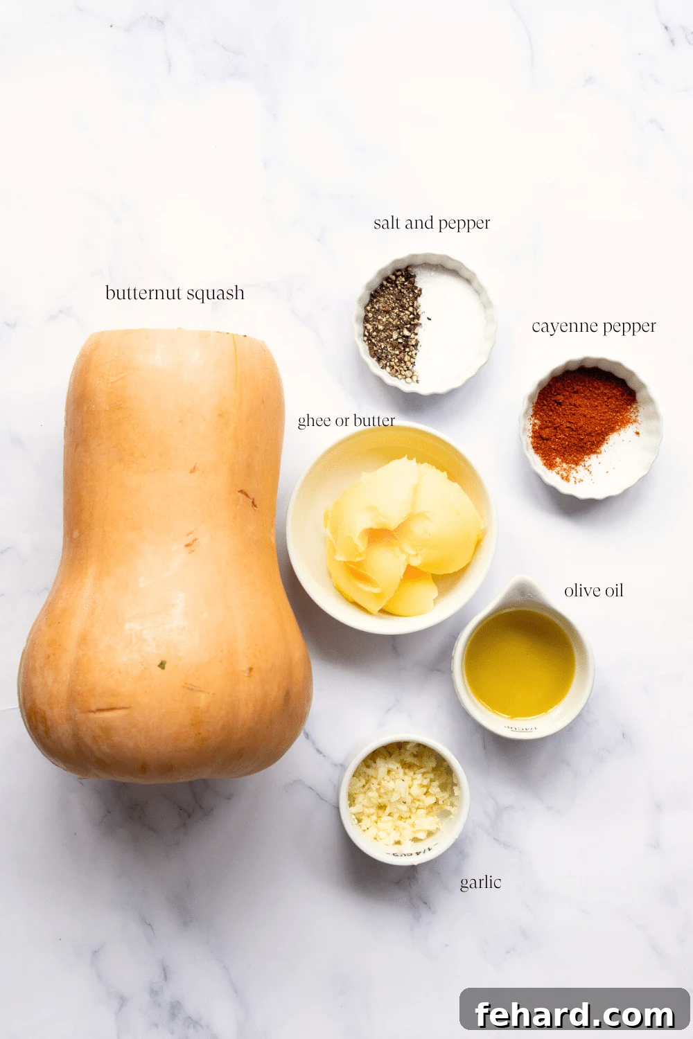 ingredients to make mashed butternut squash on a marble countertop.