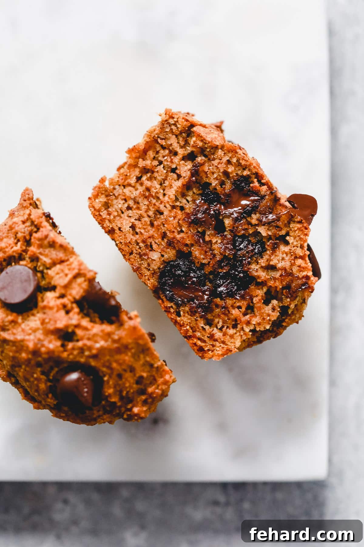Close-up of a cut Almond Flour Pumpkin Muffin with chocolate chips