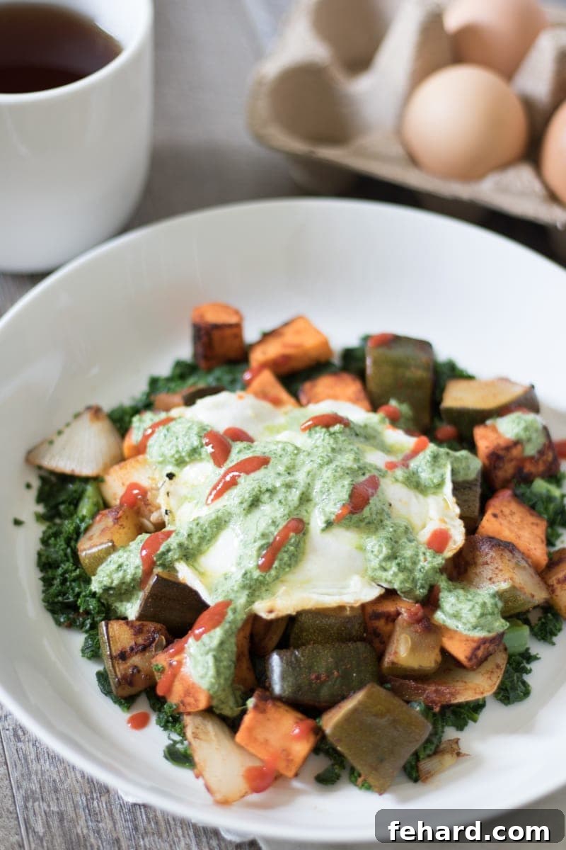 Sweet Potato Hash topped with a fried egg and cilantro pesto. A vibrant, healthy, and satisfying breakfast dish.
