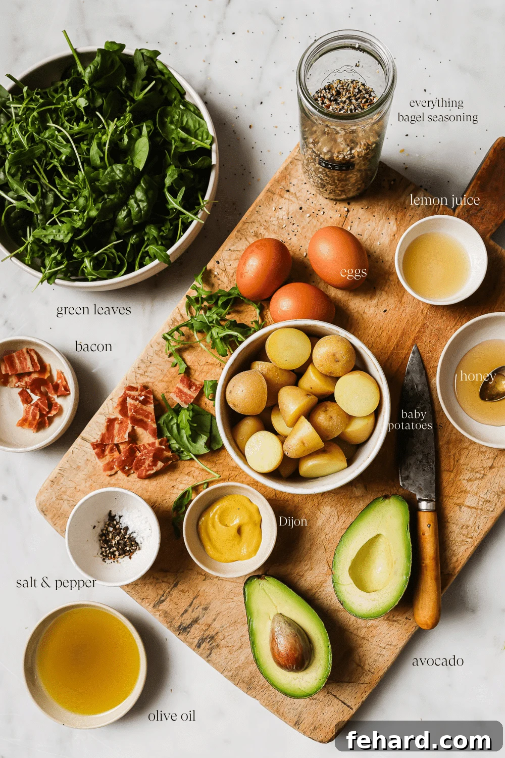 Quick & Fresh Breakfast Salad 3 An overhead view of prepared ingredients on a wooden cutting board.