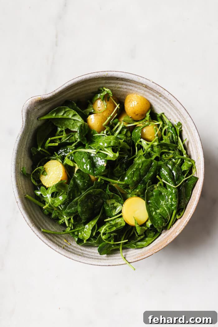 Quick & Fresh Breakfast Salad 7 Baby potatoes are added to the bowl of mixed greens.