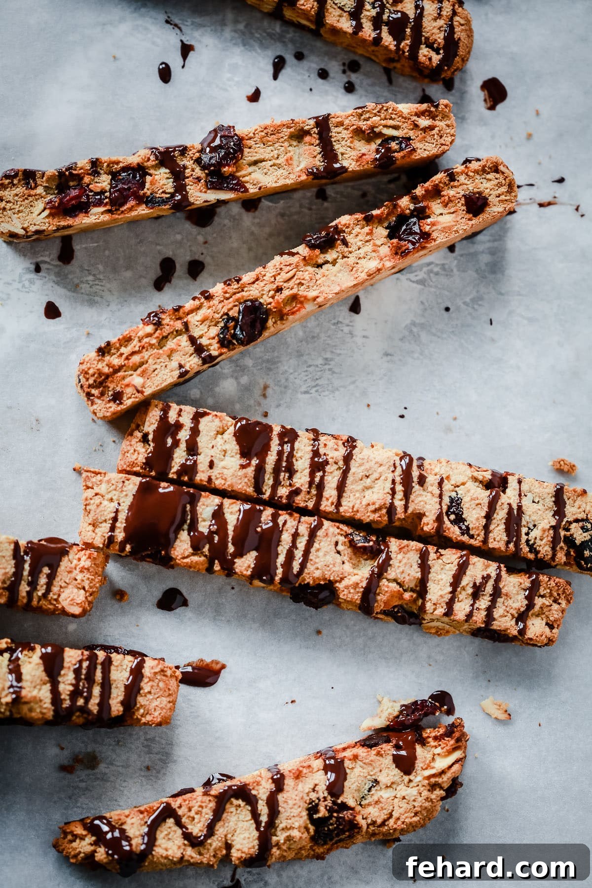 Artisan Chocolate Almond Biscotti 2 overhead view of Chocolate Almond Biscotti Cookies on a board.