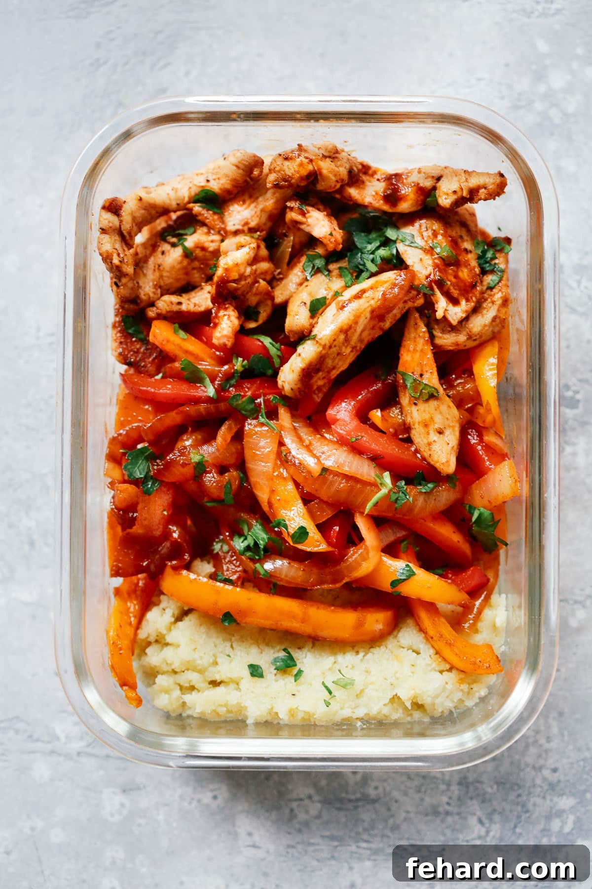 Flavor Packed Chicken Fajita Meal Prep Bowls 2 overhead view of Chicken Fajita Meal-Prep in a glass Bowl