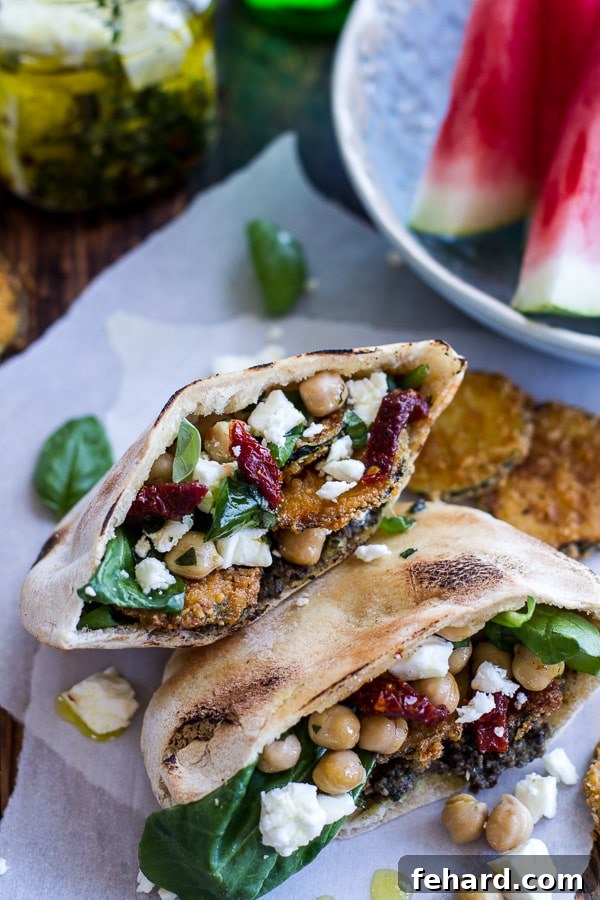 Delectable Greek olive pesto and fried zucchini grilled pitas with marinated feta and garbanzo beans, a unique picnic offering.