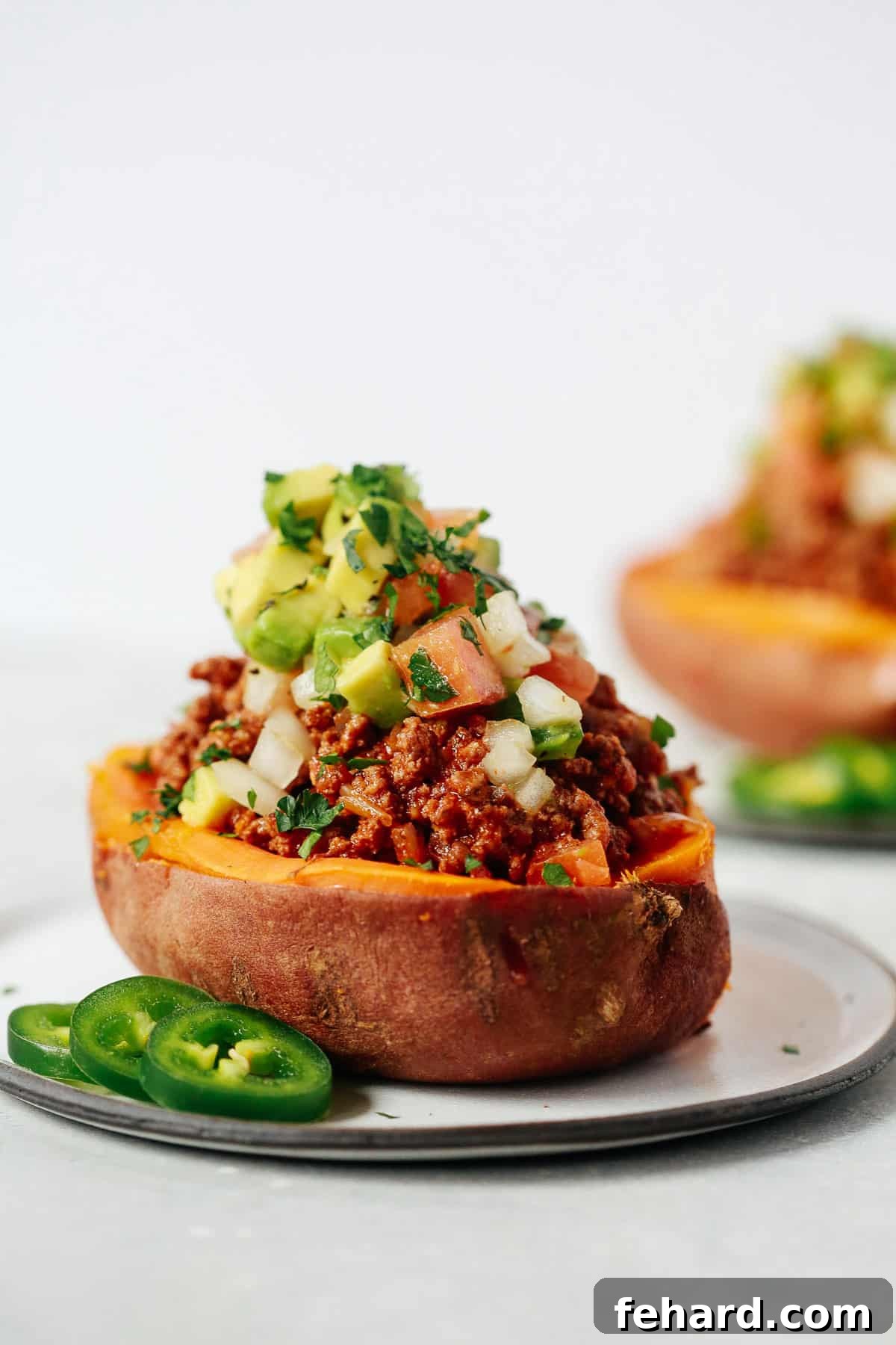 Sweet Potato Taco Boats 2 Delicious Taco Stuffed Sweet Potatoes garnished with fresh cilantro