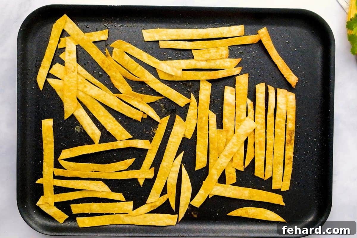 Tortilla Soup Instant Pot Corn tortillas cut into strips and seasoned and baked until crispy on baking sheet.