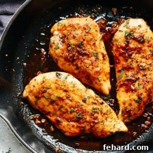 A skillet filled with garlic butter chicken breast